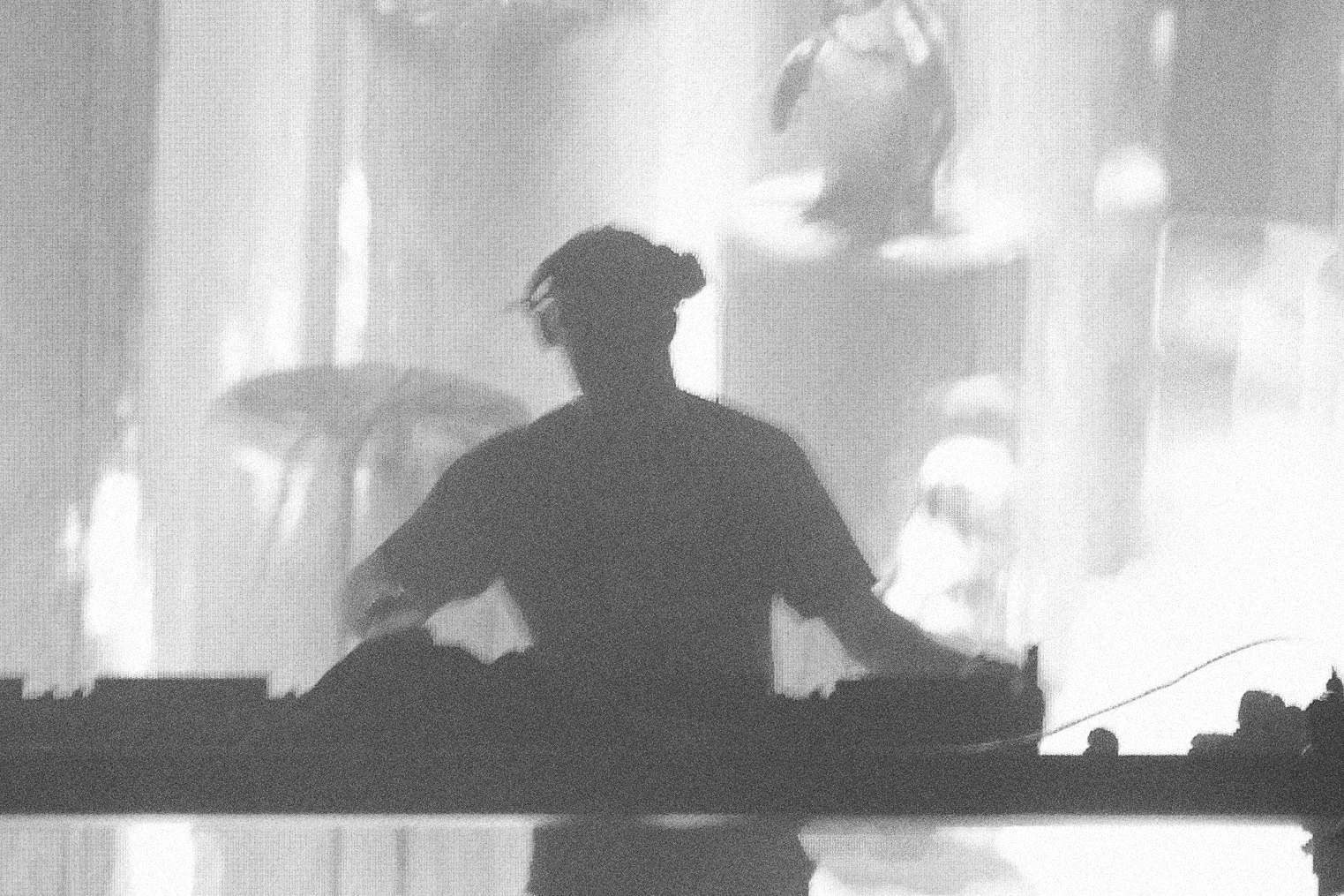Gregor Egan performing, in silhouette